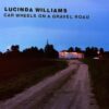 "Car Wheels On A Gravel Road"